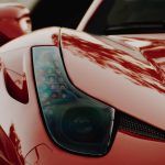 macro photography of red sports car