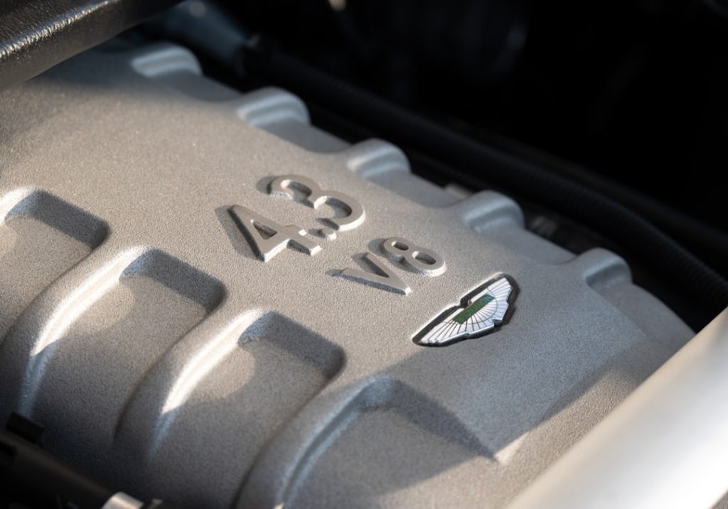 Close-up of a silver engine with "4.3 v8" inscription.