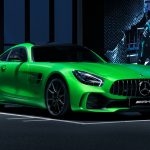 green mercedes benz coupe parked on parking lot