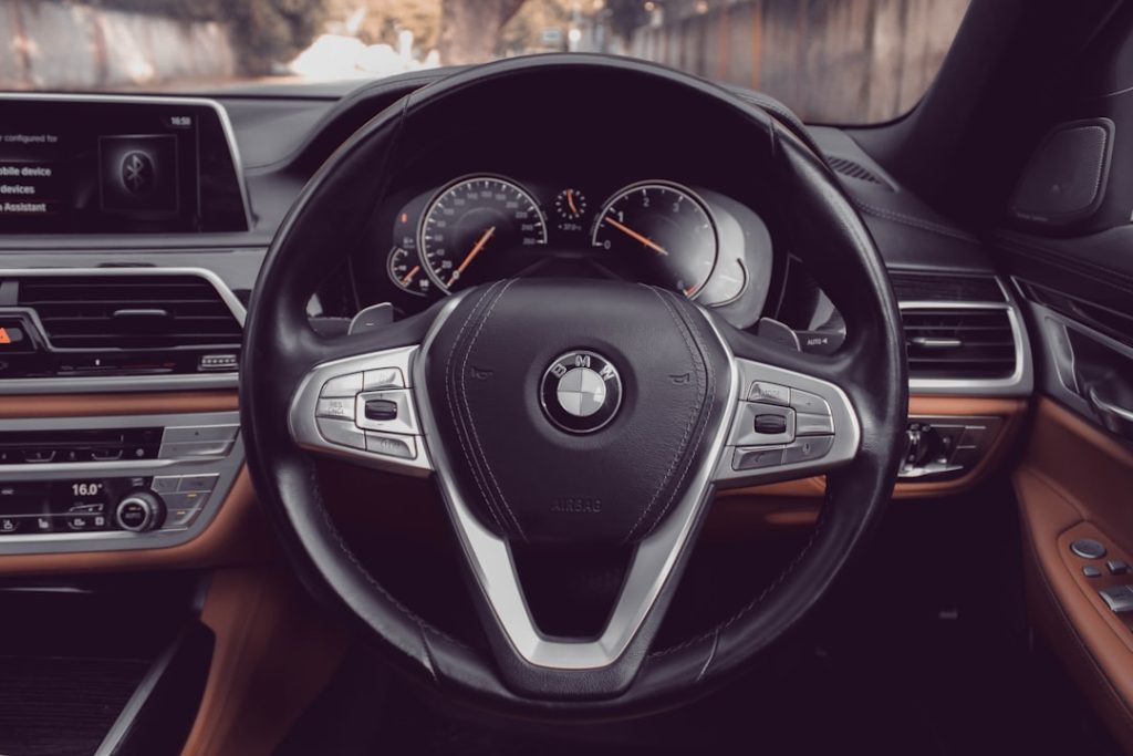 the dashboard of a bmw car with a steering wheel