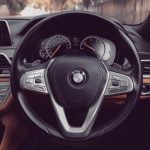 the dashboard of a bmw car with a steering wheel