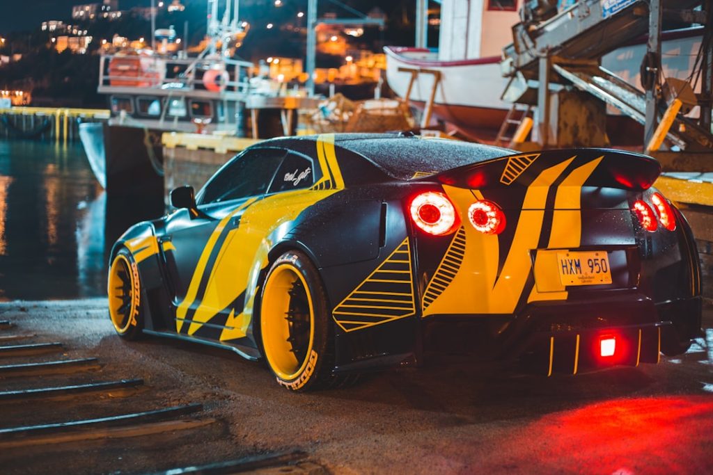 yellow and black lamborghini parked on parking lot