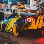 yellow and black lamborghini parked on parking lot